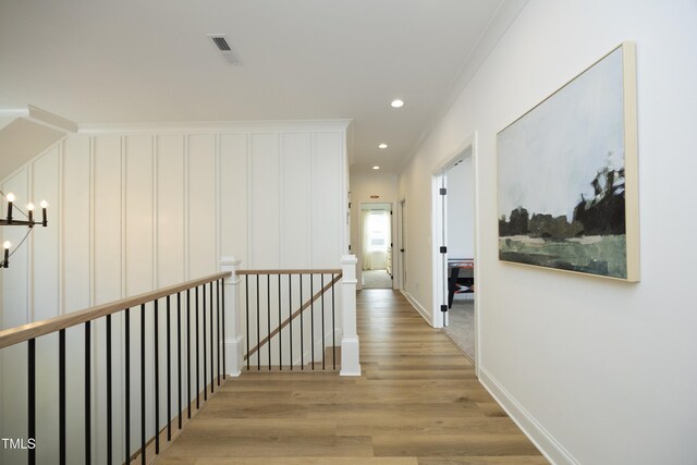2200 Mays Crossroads Rd, Louisburg, NC 27549 - hallway with an upstairs landing, light wood-type flooring, crown molding, a chandelier, and recessed lighting
