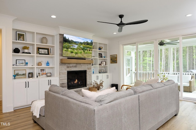 2200 Mays Crossroads Rd, Louisburg, NC 27549 - living room with a ceiling fan, crown molding, a stone fireplace, light wood finished floors, and recessed lighting
