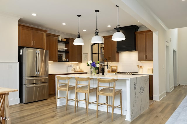 2200 Mays Crossroads Rd, Louisburg, NC 27549 - kitchen with freestanding refrigerator, open shelves, light countertops, a kitchen island with sink, and tasteful backsplash