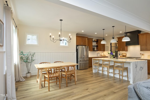 2200 Mays Crossroads Rd, Louisburg, NC 27549 - dining area featuring light wood-type flooring, a wainscoted wall, a chandelier, recessed lighting, and ornamental molding