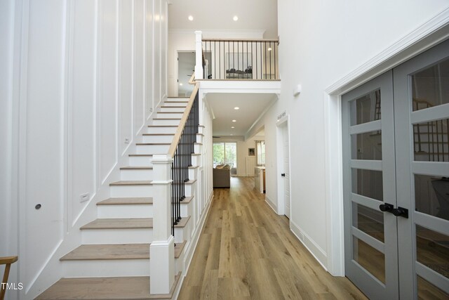2200 Mays Crossroads Rd, Louisburg, NC 27549 - stairway with wood finished floors, french doors, recessed lighting, and baseboards