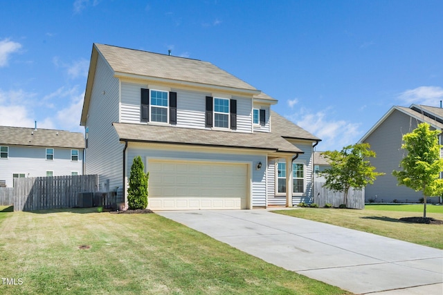 traditional-style home featuring a garage, concrete driveway, and central AC unit