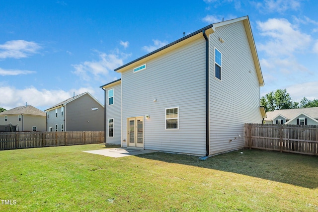 rear view of property featuring a patio area and french doors