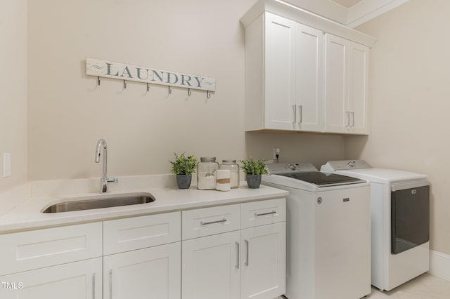 clothes washing area with cabinet space and washing machine and clothes dryer