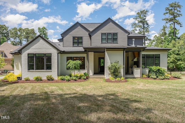view of front of property with brick siding, a shingled roof, and a porch
