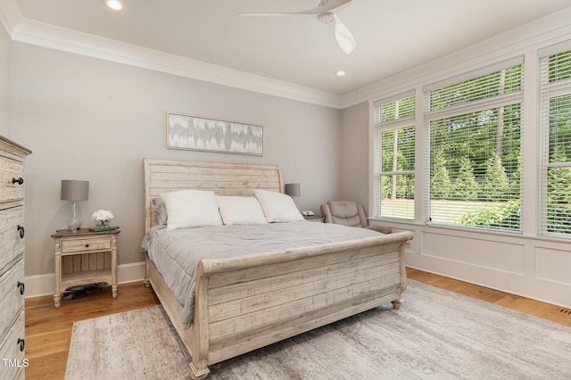 bedroom featuring crown molding, light wood-type flooring, ceiling fan, and recessed lighting