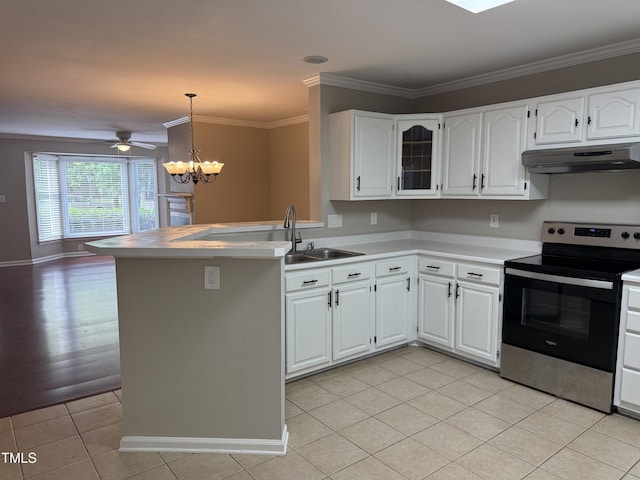 kitchen with stainless steel electric range, under cabinet range hood, a sink, light tile patterned flooring, and a chandelier