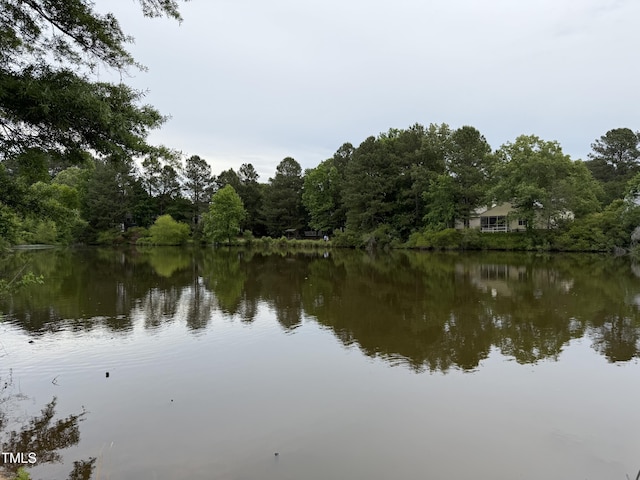 water view featuring a heavily wooded area
