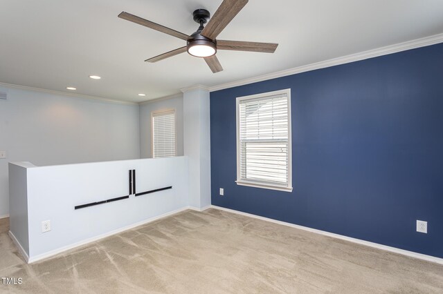 spare room with ornamental molding, a ceiling fan, carpet flooring, baseboards, and recessed lighting