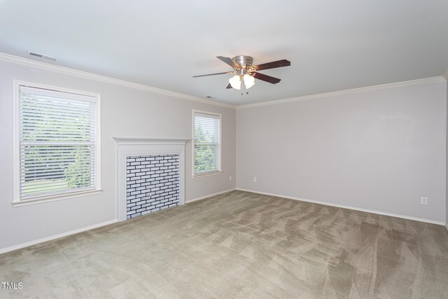 unfurnished living room with ceiling fan, carpet floors, ornamental molding, and baseboards