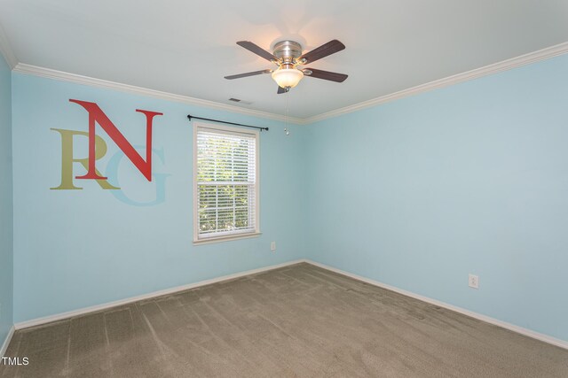 unfurnished room with crown molding, baseboards, carpet floors, and a ceiling fan
