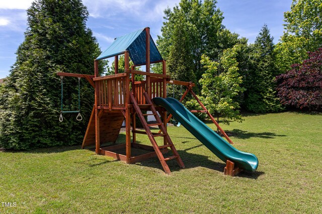 view of playground with a lawn
