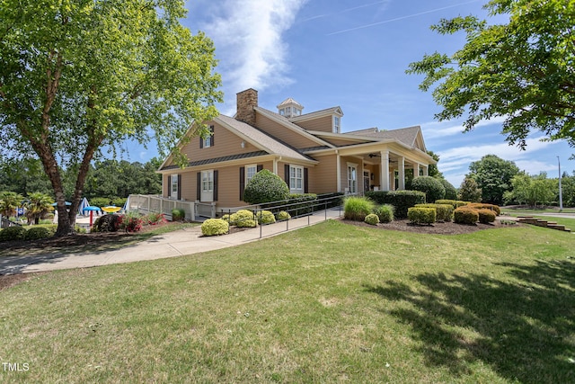 view of front of home with a chimney and a porch