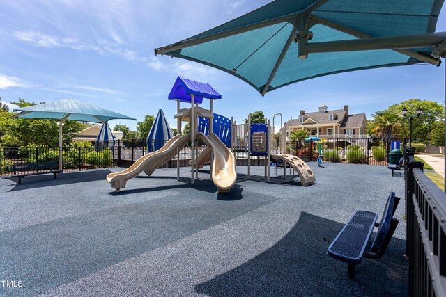 communal playground featuring fence