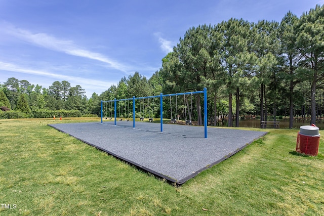 communal playground with a lawn and view of scattered trees