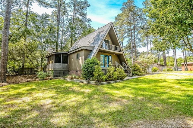 rear view of house featuring a sunroom, stairs, and crawl space