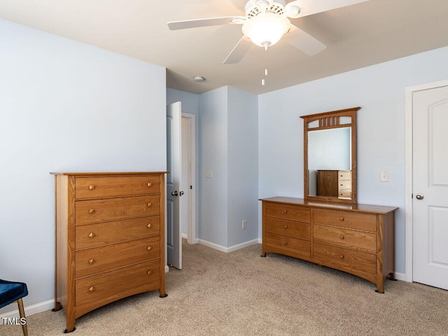 bedroom with light carpet, baseboards, and ceiling fan