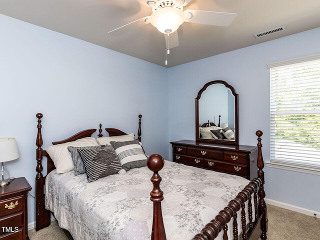 bedroom with carpet, baseboards, and a ceiling fan