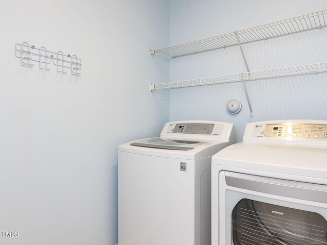 laundry room featuring washer and clothes dryer