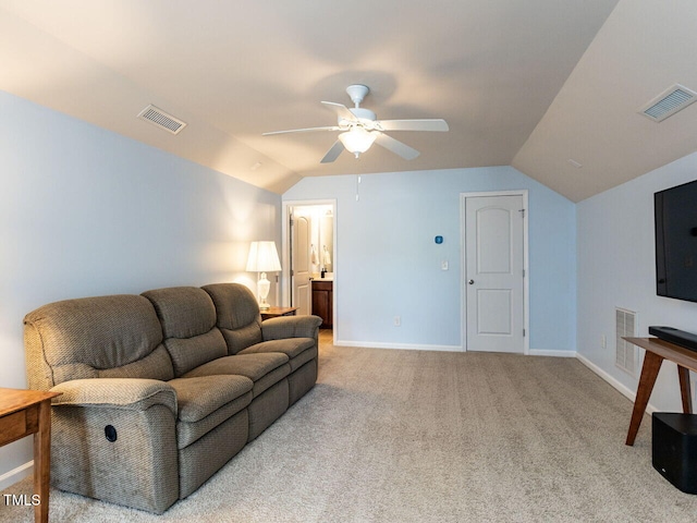 living area featuring vaulted ceiling, carpet floors, a ceiling fan, and baseboards