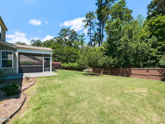 view of yard featuring a sunroom