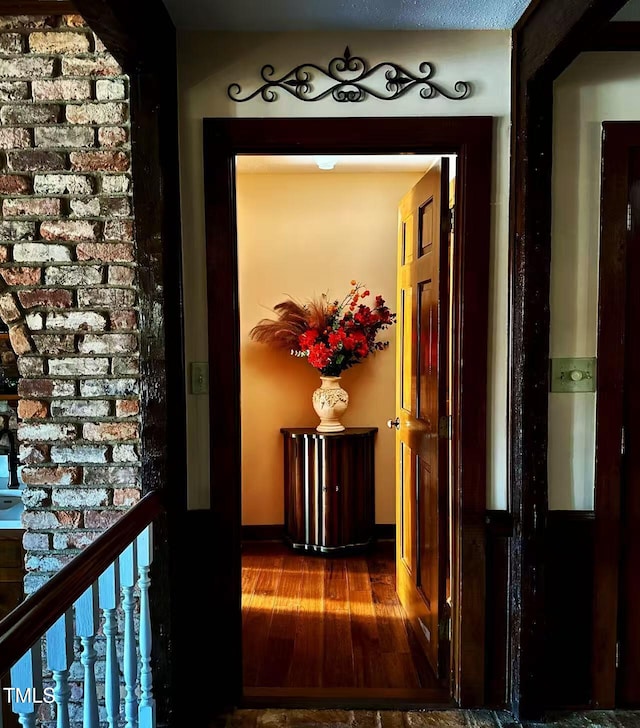 corridor featuring wood finished floors