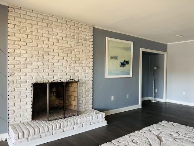 unfurnished living room featuring baseboards, dark wood-type flooring, a brick fireplace, and ornamental molding