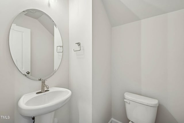 bathroom featuring toilet and a sink