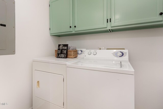 laundry area featuring cabinet space, washer and dryer, and electric panel