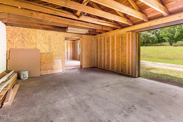 miscellaneous room with unfinished concrete flooring