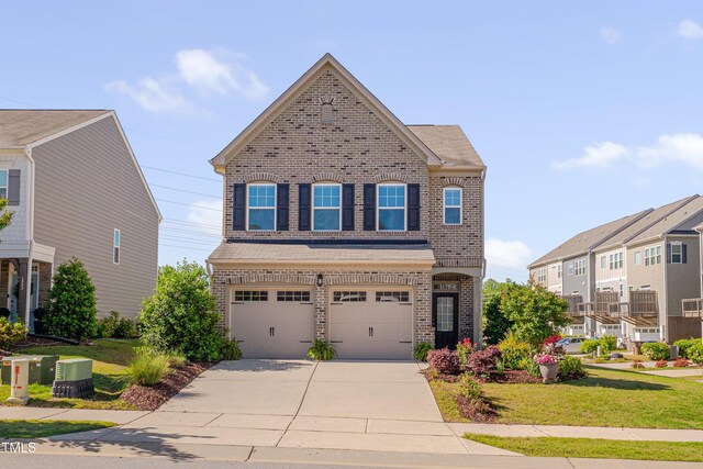 view of front of house with brick siding, a garage, concrete driveway, and a front lawn