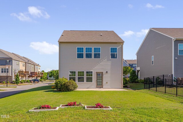 back of house featuring a patio and a residential view