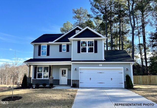 view of front of property featuring fence, driveway, a porch, brick siding, and board and batten siding