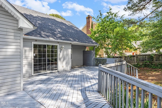 wooden deck featuring fence