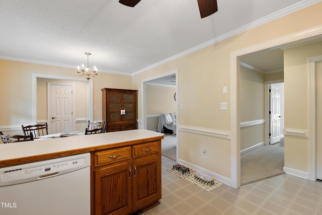 kitchen with white dishwasher, a ceiling fan, a chandelier, ornamental molding, and light countertops