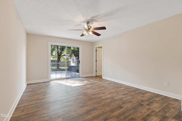 spare room featuring a ceiling fan, dark wood-style flooring, baseboards, and a textured ceiling