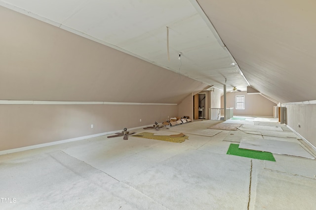 bonus room featuring lofted ceiling and baseboards