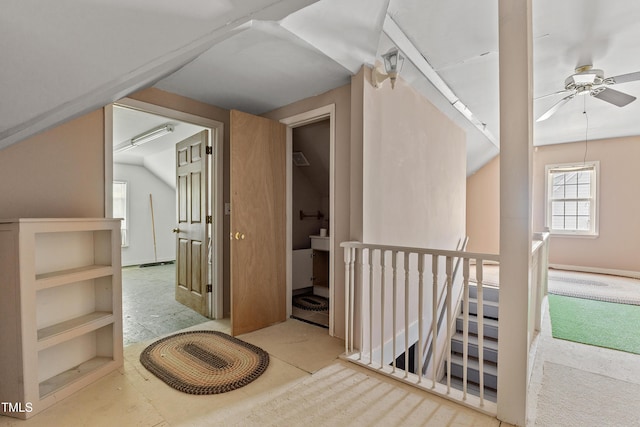 bonus room with a ceiling fan and lofted ceiling