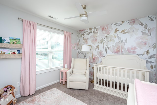 1048 Flagler St, Durham, NC 27713 - carpeted bedroom with a crib, multiple windows, baseboards, and a ceiling fan