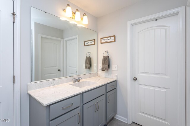 1048 Flagler St, Durham, NC 27713 - bathroom with vanity and baseboards