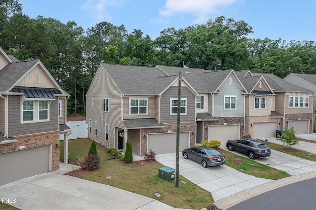 1048 Flagler St, Durham, NC 27713 - view of property featuring driveway, a garage, a front lawn, and a shingled roof