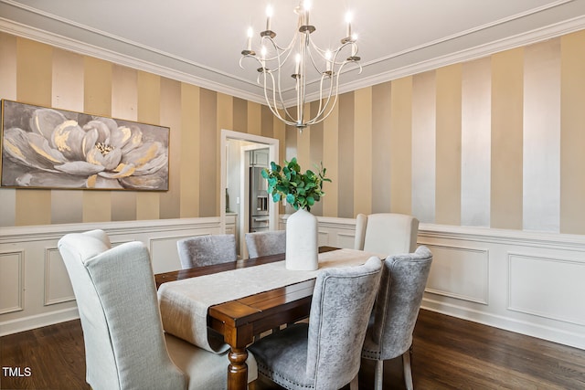 101 Parkbow Ct, Cary, NC 27519 - dining room featuring wallpapered walls, a chandelier, crown molding, wainscoting, and dark wood-style flooring