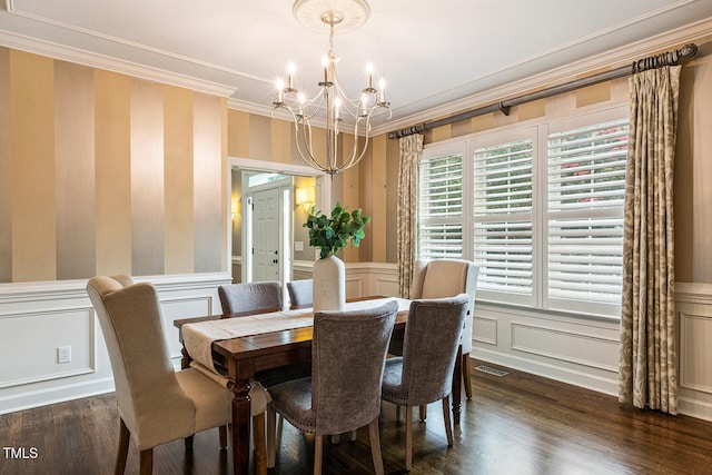 101 Parkbow Ct, Cary, NC 27519 - dining area with a chandelier, crown molding, a decorative wall, dark wood finished floors, and wallpapered walls