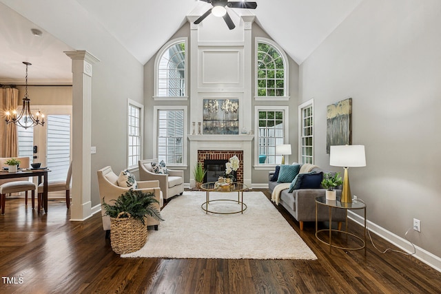 101 Parkbow Ct, Cary, NC 27519 - living area featuring a fireplace, high vaulted ceiling, a chandelier, a ceiling fan, and dark wood-style flooring