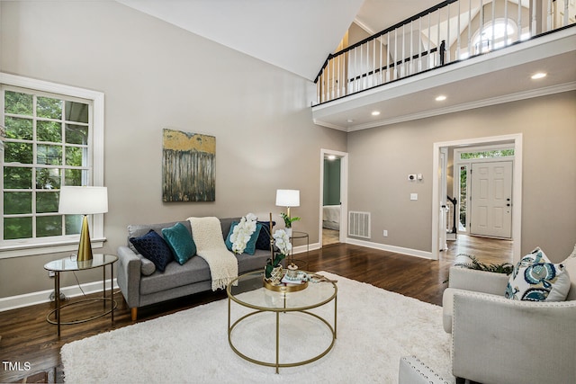 101 Parkbow Ct, Cary, NC 27519 - living area with wood finished floors, high vaulted ceiling, and ornamental molding