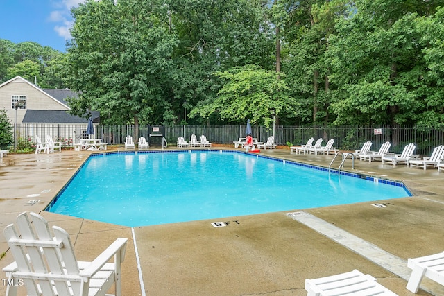 101 Parkbow Ct, Cary, NC 27519 - community pool featuring a patio area and view of scattered trees