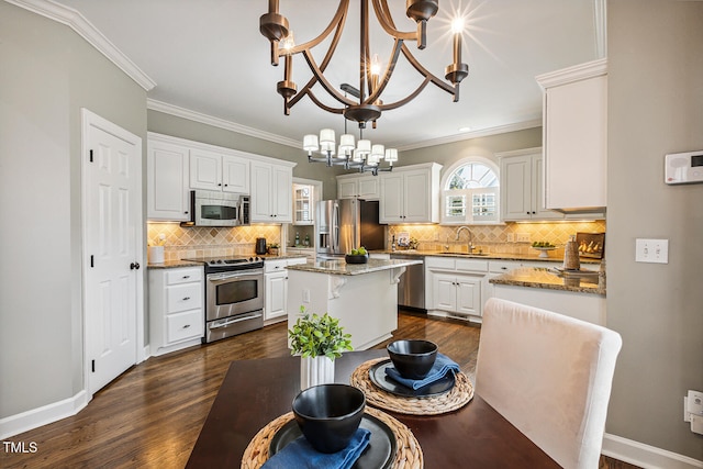 101 Parkbow Ct, Cary, NC 27519 - dining area featuring ornamental molding, dark wood-style flooring, and a chandelier