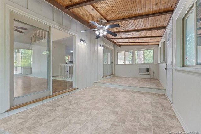 unfurnished sunroom featuring a wall mounted air conditioner