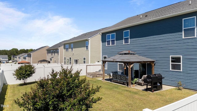 back of property featuring a gazebo, an outdoor living space, a patio area, and a residential view