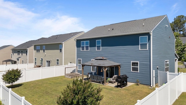 back of property with a gazebo, an outdoor living space, and a patio